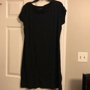 Knit black dress. Can wear over bathing suit.